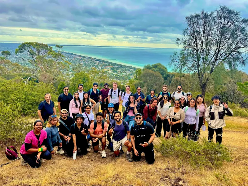 Social Hikes Australia group scrambling over rocks beside the river in Werribee Gorge — photo 5